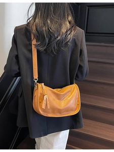 Vintage camel crescent crossbody bag with adjustable strap and textured matte finish