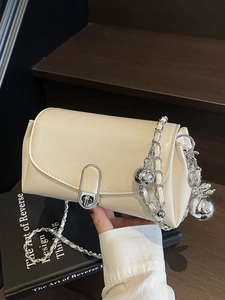 Creamy white oil wax leather crossbody bag with silver chain and metal ball charm