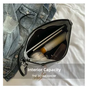Top view of large black tote bag showing spacious interior with tablet and daily essentials