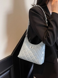 Light blue quilted leather hobo bag with silver chain strap and metal lock closure