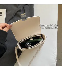 Internal view of a white saddle bag showing spacious capacity for phone and cosmetics