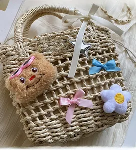 Close-up of woven bucket bag with teddy bear, bows, and floral decorations