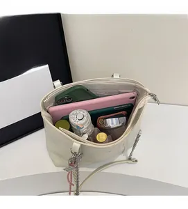 Top view of white large tote bag showing spacious interior with tablet and daily items