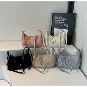 Collection of pleated leather crescent bags in five colors with silver chain straps