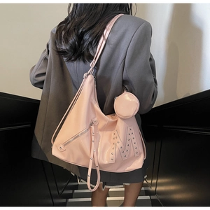 Pink oversized hobo bag with silver rivet M logo and detachable round coin purse charm