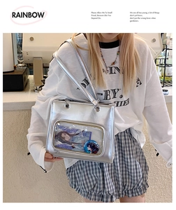 Silver metallic crossbody bag with clear window featuring anime display and long handle