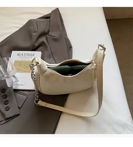 Interior view of off-white hobo bag showing space for phone and essentials