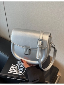 Silver metallic saddle bag with geometric buckle and adjustable leather shoulder strap