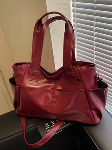 Elegant wine red leather tote bag for women featuring large capacity and multi-pockets
