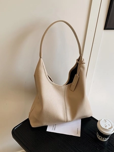 Chic beige pebbled leather hobo bag with large capacity for stylish daily commuting