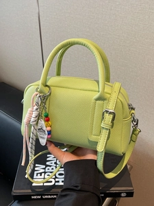 Light green litchi texture boston shoulder bag with decorative vintage hangtags