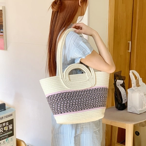 Detail showing thick woven texture and purple diamond pattern on large tote bag