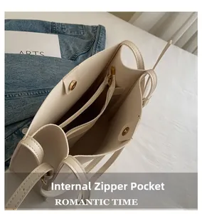 Detail view of the bag interior with zipper pocket and magnetic buckle closure