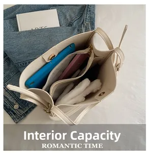 Detailed view of the internal capacity and multi-compartment layout of the cream tote bag