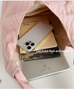 Spacious pink tote bag interior showing capacity for iPad, books and smartphone