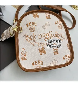 Detailed macro view of litchi textured faux leather with bear pattern and gold buckle