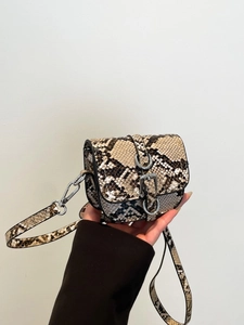 Mini snakeskin pattern saddle crossbody bag with silver buckle and adjustable strap