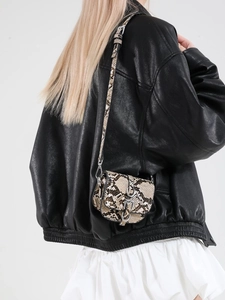Chic snakeskin print mini saddle crossbody bag with silver hardware for women