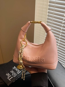 Women Trendy PU Leather Dumpling Hobo Bag Embossed Letter Underarm Shoulder Bag With Braided Rope Bell Charm Handbag For Daily