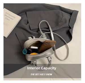 Interior view showing capacity of silver metallic pillow bag with daily essentials