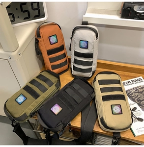 Detail of tactical chest bags in multiple colors with MOLLE system and nylon texture