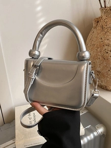 Silver metallic mini tote bag with round top handle and detachable shoulder strap