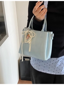 Fashionable light blue bucket handbag with pearl bow charm and doll pendant for women