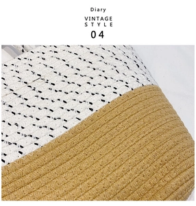 Detail of bicolor woven straw beach bag featuring white rope knit and khaki texture