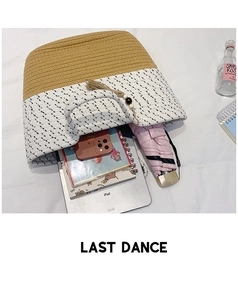 Interior view showing large capacity of woven straw tote bag with iPad and accessories