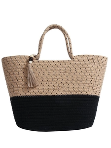 Large straw tote bag in a two-tone natural and black weave with fringe tassel