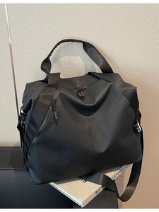 Large black travel duffel bag with shoulder strap for sports and commute