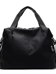 Black waterproof nylon travel bag with crossbody strap and large capacity design