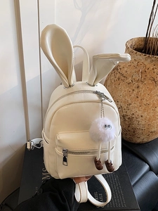 Chic beige PU leather backpack for women featuring cute rabbit ears and a plush charm