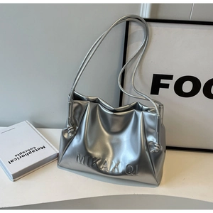 Close-up of a silver pleated shoulder bag with embossed logo and knotted rope strap