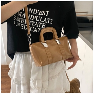 Caramel brown PU leather Boston bag with vertical stitching and silver hardware
