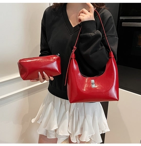 Glossy red leather crescent hobo bag set with matching makeup pouch for women