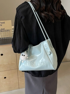 Light blue patent leather shoulder bag with drawstring detail and plush charm decoration