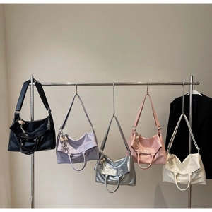 Selection of glossy oil wax leather tote bags in various colors with pearl heart charms