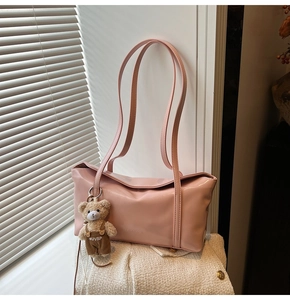 Pink synthetic leather shoulder bag with SLEAROK logo and cute plush bear charm