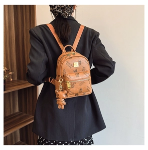 Detail of vintage brown college style backpack with bear print and 1992 university logo