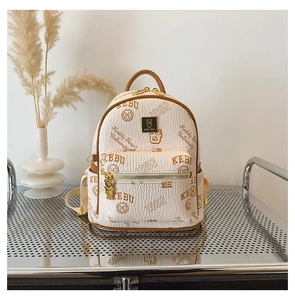 Detail of cream mini backpack with vintage letter prints and metallic bear emblem