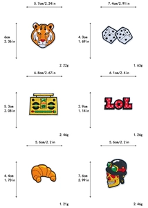 Detail view of 6 cartoon embroidered patches including tiger and radio with size specs