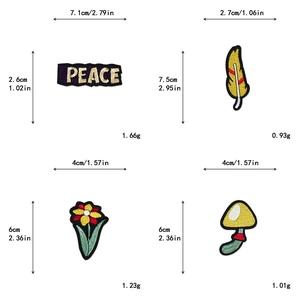 Detailed view of DIY embroidered patches with peace, feather, flower, and mushroom designs