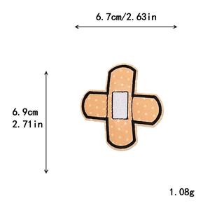 Embroidered band-aid shape patch with white dots and black edges, 6.7x6.9cm size detail