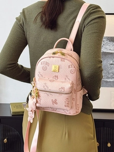 Pink lychee leather mini backpack with bear patterns and soft bear pendant accessory