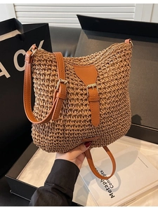 Straw crossbody bag with adjustable leather strap for summer beach fashion