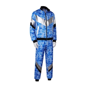 Jaren 80 retro disco trainingspak met blauwe pixelprint en zilveren V-strepen