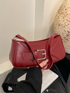 Deep red PU leather baguette underarm bag with silver buckle and sleek vintage design
