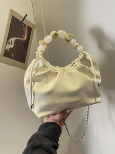 Chic beige pleated dumpling bag with faux croc pattern and marble resin bead handle