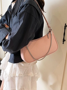 Pink woven baguette shoulder bag with silver chain strap for women casual daily wear